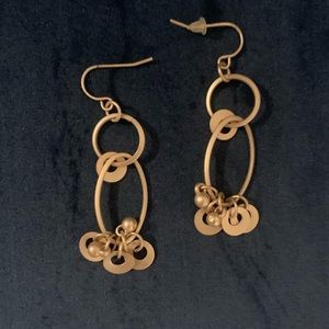 Gold tone dangle disk earrings